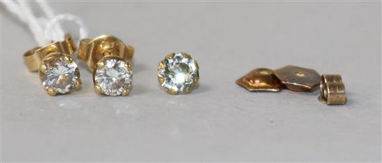 A pair of yellow metal and solitaire diamond ear studs, three 9ct gold butterflies and a 9ct gold ear stud.